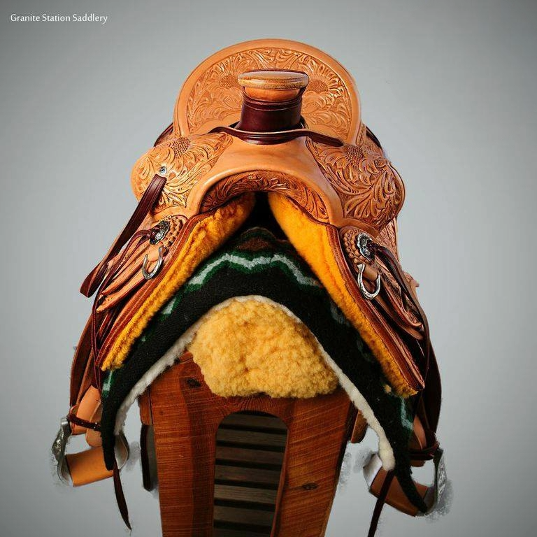 Front view of Carved saddle sitting on saddle tree